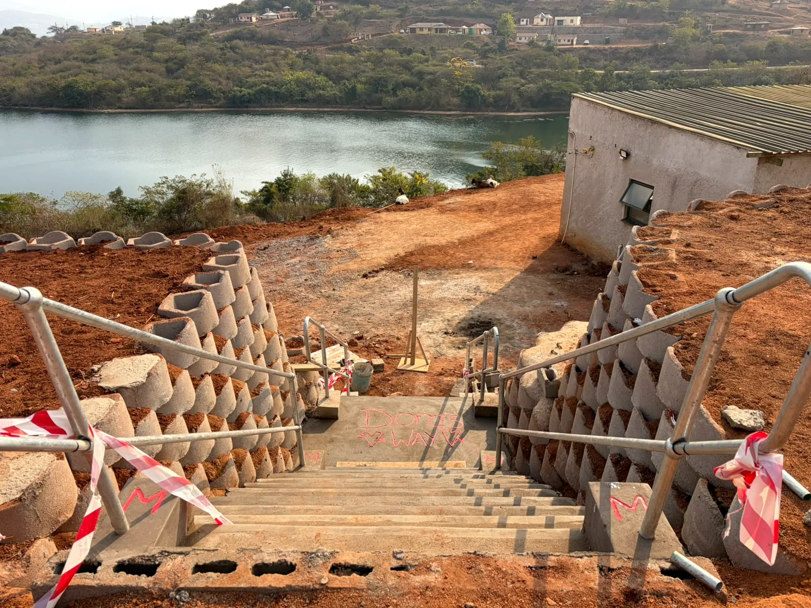 Completed concrete access stairway with retaining structures